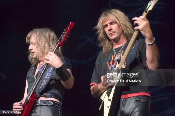 British heavy metal group Judas Priest perform onstage at the Tweeter Center, Chicago, Illinois, August 21, 2004. Pictured are guitarists KK Downing...