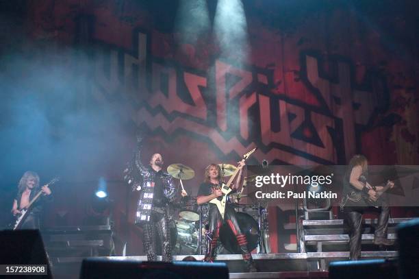 British heavy metal group Judas Priest perform onstage at the Tweeter Center, Chicago, Illinois, August 21, 2004. Pictured are, from left, guitarist...