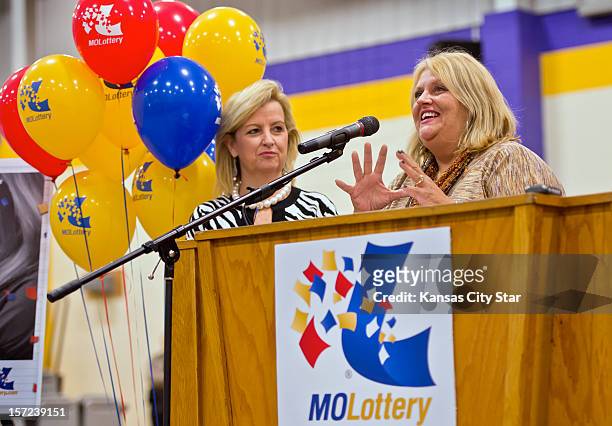 Cindy Hill, right, smiles during the news conference at North Platte High School in Dearborn, Missouri, Friday, November 30 as Hill described how she...