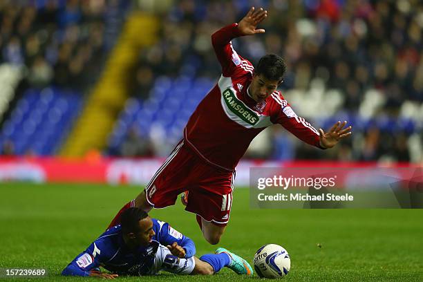Robert Hall of Birmingham City is fouled by Emmanuel Ledesma of Middlesbrough during the npower Championship match between Birmingham City and...