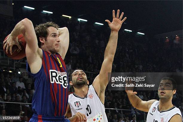 Marcelinho Huertas of FC Barcelona Regal competes with Fikret Can Akin and Serhat Cetin of Besiktas JK Istanbul during the 2012-2013 Turkish Airlines...