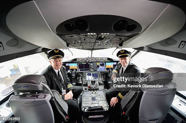 United Airlines Captain Stephen Kastner and First officer Mike McCann sit in the cockpit of the new Boeing 787 Dreamliner at Los Angeles...