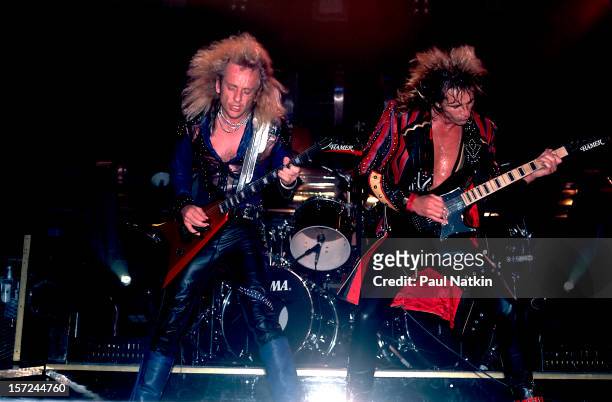 British heavy metal group Judas Priest perform onstage, 1986. Pictured are guitarists KK Downing and Glenn Tipton.