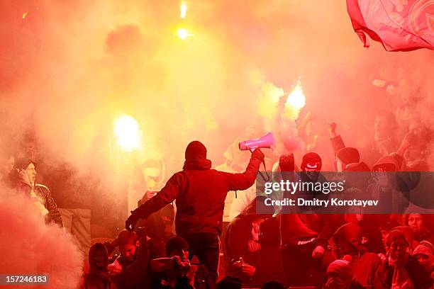 Spartak Moscow fans light flares during the Russian Premier League match between FC Spartak Moscow and FC Zenit St. Petersburg at the Luzhniki...