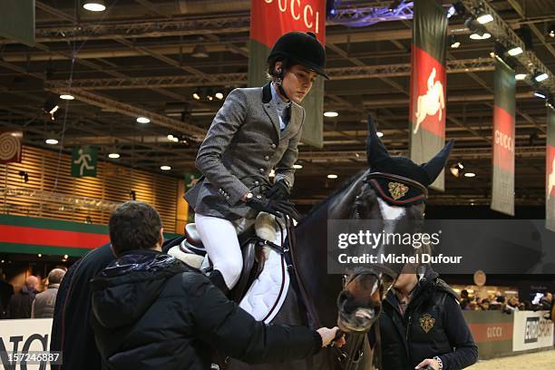 Charlotte Casiraghi and Thierry Rozier attend the Gucci Paris Masters 2012 at Paris Nord Villepinte on November 30, 2012 in Paris, France.