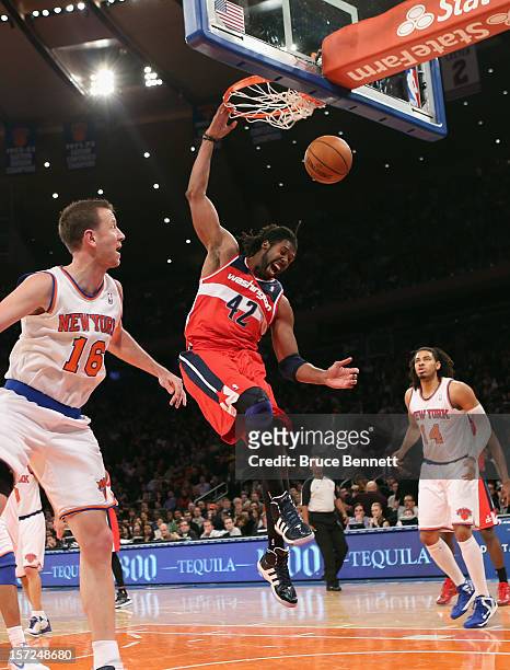 Nenê of the Washington Wizards scores two against the New York Knicks in the second quarter at Madison Square Garden on November 30, 2012 in New York...