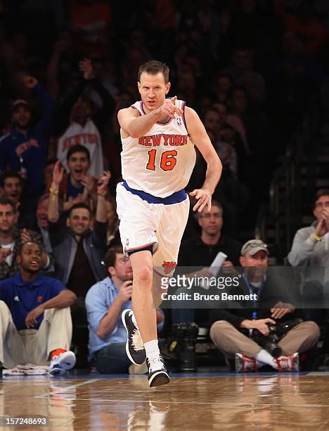Steve Novak of the New York Knicks signals after scoring a three pointer against the Washington Wizards at Madison Square Garden on November 30, 2012...