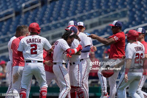 Abrams of the Washington Nationals celebrates with teammates after he hits a walk-off single against the Colorado Rockies at Nationals Park on July...