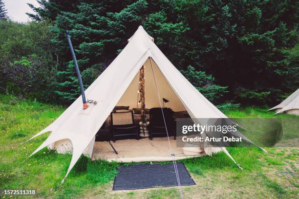 glamping tent with luxury and comfortable inside in the middle of the nature. - teepee stock pictures, royalty-free photos & images