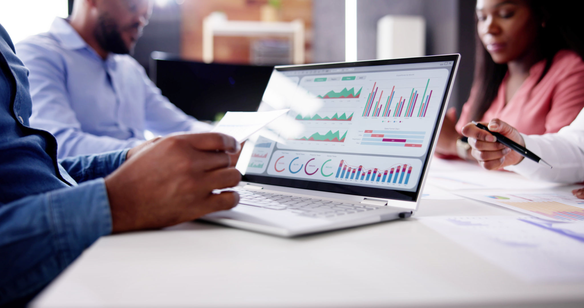 Financial Advisor Group Meeting Examining Analytics Financial Advisor Group Meeting Examining Analytics