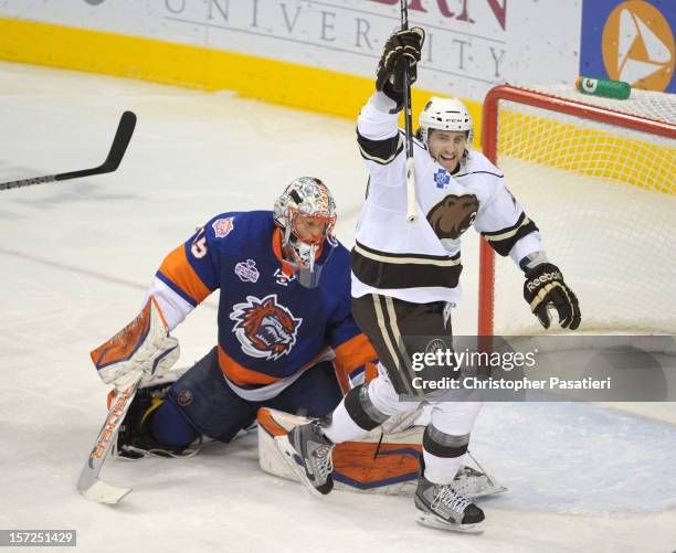 Alex Berry of the Hershey Bears reacts to a goal during an American Hockey League game against the Bridgeport Sound Tigers on November 30, 2012 at...