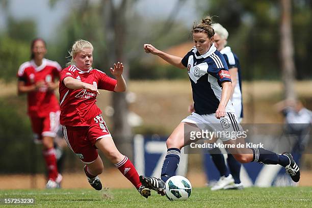 Jessica Waterhouse of Adelaide competes with Amy Jackson of Melbourne during the round seven W-League match between Adelaide United and the Melbourne...