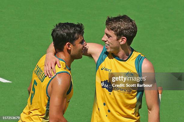 Chris Ciriello of Australia is congratulated by Simon Orchard after scoring a goal during the match between Australia and Belgium on day one of the...