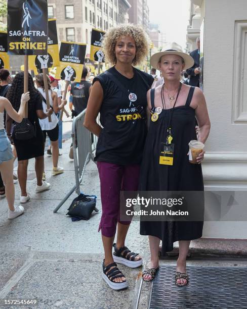 Samantha Mathis and SAG-AFTRA Vice President - Los Angeles Michelle Hurd join SAG-AFTRA members as they continue to picket on July 26, 2023 in New...