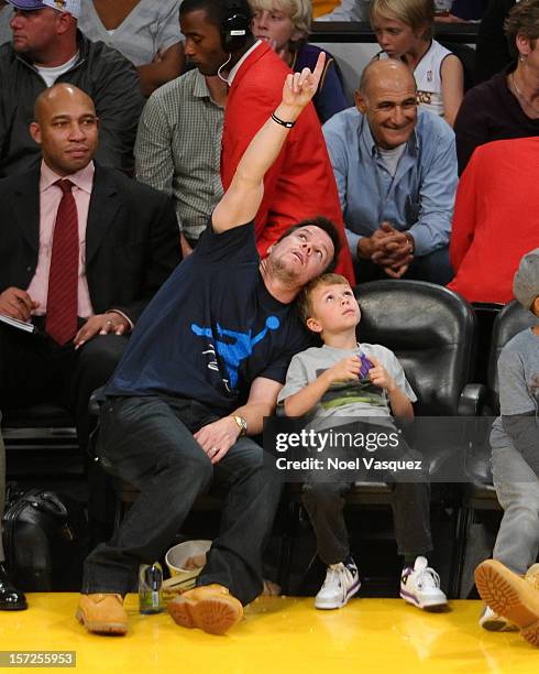 Mark Wahlberg and his son Michael Robert Wahlberg attend a basketball game between the Denver Nuggets and the Los Angeles Lakers at Staples Center on...