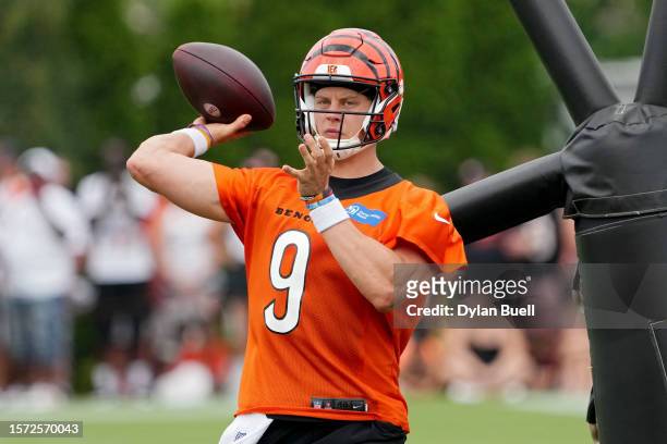 Joe Burrow of the Cincinnati Bengals participates in a drill during training camp at Kettering Health Practice Fields on July 26, 2023 in Cincinnati,...
