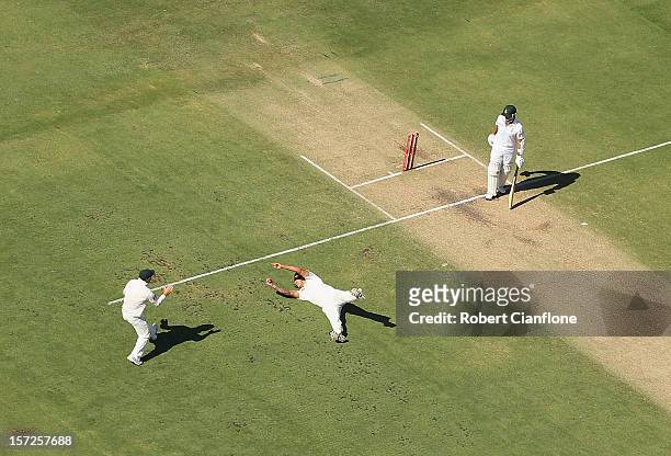 Mitchell Johnson of Australia dives to take the catch of Alviro Petersen of South Africa during day two of the Third Test Match between Australia and...