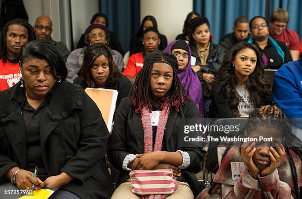 Parents and students listen as DC Public Schools Chancellor Kaya Henderson is questioned at the Wilson Building Thursday, November 15, 2012 in...