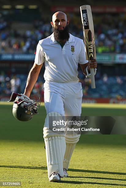 Hashim Amla of South Africa acknowledges the crowd as he walks from the ground after he finished the day on 99 not out on day two of the Third Test...