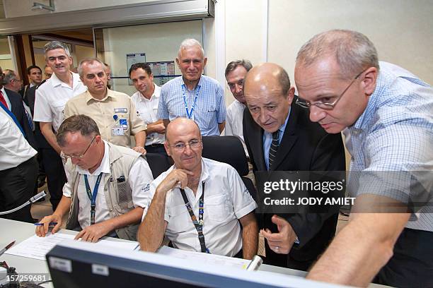 French Defence Minister Jean-Yves Le Drian visits the PC Uranus at the European space centre of Kourou, French Guiana, on November 30 as part of a...