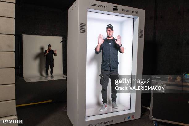 David Nussbaum, Founder and CEO of Porto Hologram, demonstrates how the hologram technology works, in Van Nuys, California, on August 1, 2023. More...