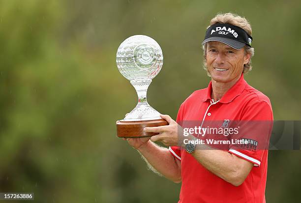 Bernhard Langer of Germany poses with the trophy after winning the Nedbank Champions Challenge at the Gary Player Country Club on December 1, 2012 in...