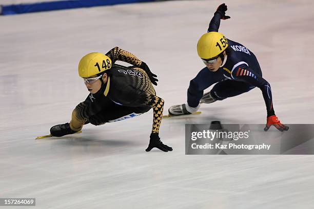 Yun-Jae Kim of Korea chases Yuzo Takamido of Japan in the Men 1500m Final B during day two of the ISU World Cup Short Track at Nippon Gaishi Arena on...