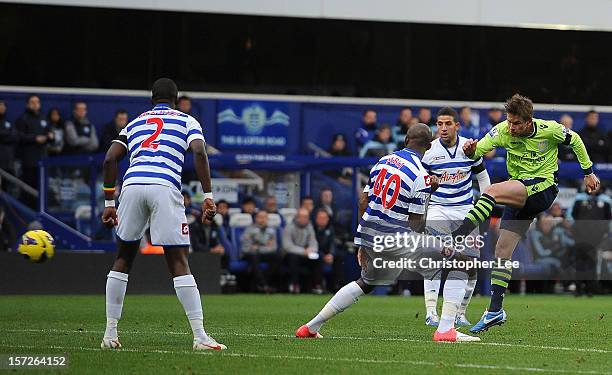 Brett Holman of Aston Villa scores the opening goal during the Barclays Premier League match between Queens Park Rangers and Aston Villa at Loftus...