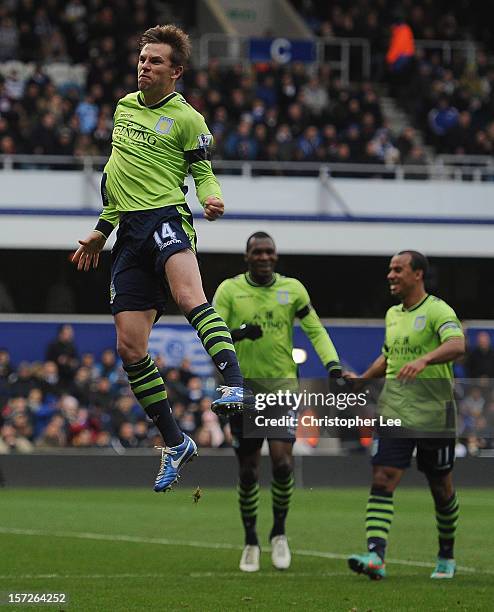 Brett Holman of Aston Villa celebrates scoring the opening goal during the Barclays Premier League match between Queens Park Rangers and Aston Villa...