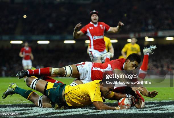 Wycliff Palu of Australia dives to save a certain try from Toby Faletau of Wales during the International match between Wales and Australia at...