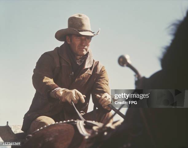 American actor Charlton Heston plays the titular cowboy in the western film 'Will Penny', 1968.