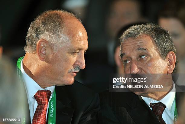 Brazilian head coach Luis Felipe Scolari and 1994 world champion coach Carlos Alberto Parreira chat attend the draw for next June's Confederations...