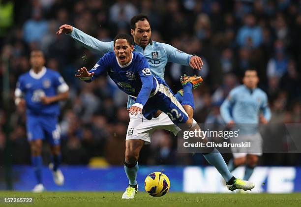 Steven Pienaar of Everton tangles with Joleon Lescott of Manchester City during the Barclays Premier League match between Manchester City and Everton...