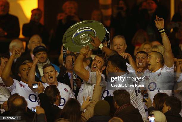 Captain Chris Robshaw of England lifts the Sir Edmund Hillary Shield during the QBE International match between England and New Zealand at Twickenham...