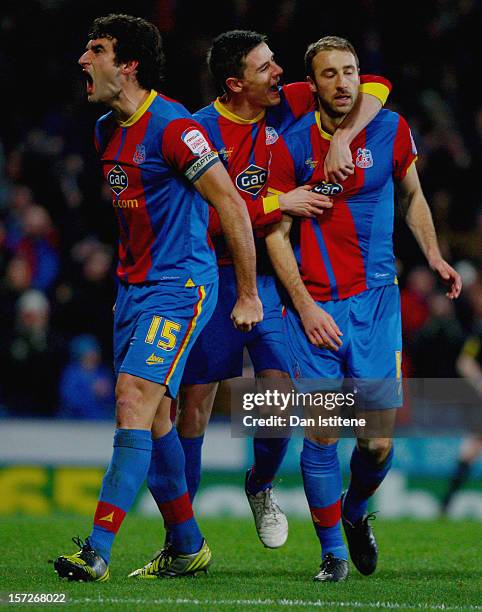 Glenn Murray of Crystal Palace celebrates with team-mates Mile Jedinak and Owen Garvan after scoring from the penalty spot during the npower...