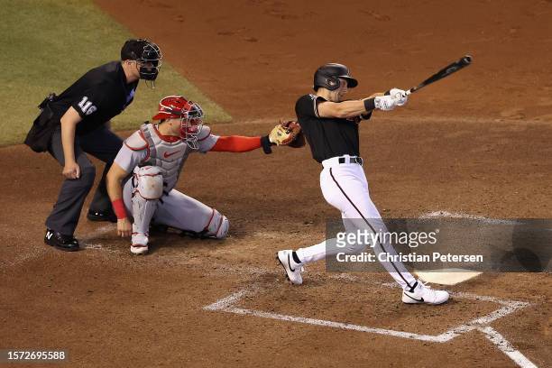 Dominic Canzone of the Arizona Diamondbacks hits a RBI single against the St. Louis Cardinals during the third inning of the MLB game at Chase Field...