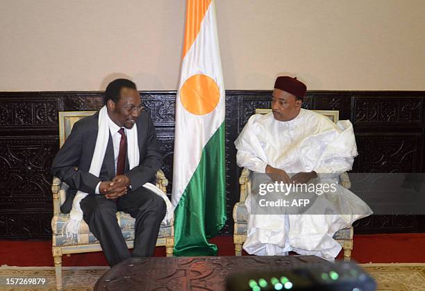 Niger's President Mahamadou Issoufou meets with Mali's interim government President Dioncounda Traore in Niamey on December 1, 2012 to discuss the...