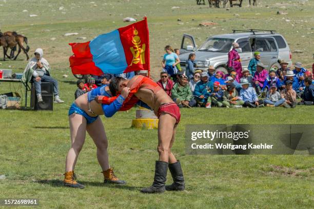 The Mongolian traditional wrestling event at a local Naadam Festival in the Sagsai River valley, a remote valley in the Altai Mountains near Altai...