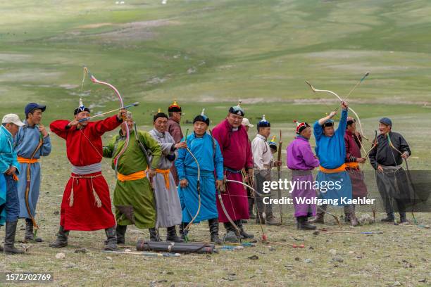The archery event at a local Naadam Festival in the Sagsai River valley, a remote valley in the Altai Mountains near Altai Sum about 200 kilometers...