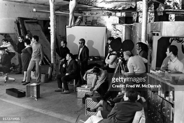 View of the cast and crew during the filming of the movie 'Camp,' directed by pop artist Andy Warhol at his studio, the Factory , New York, New York,...