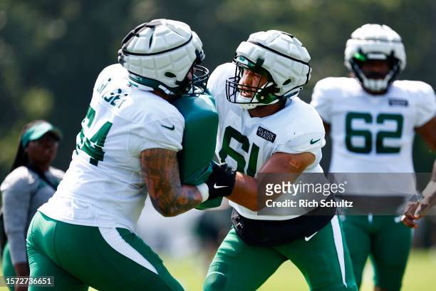 Offensive tackles Chris Glaser and Max Mitchell of the New York Jets battle each other during training camp at Atlantic Health Jets Training Center...