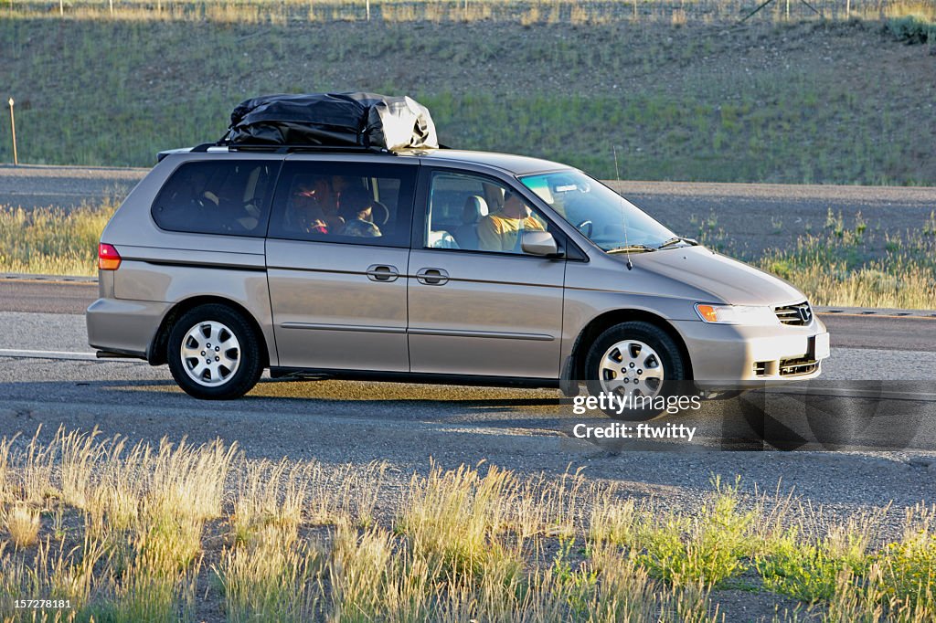 Family vacation in a gray minivan