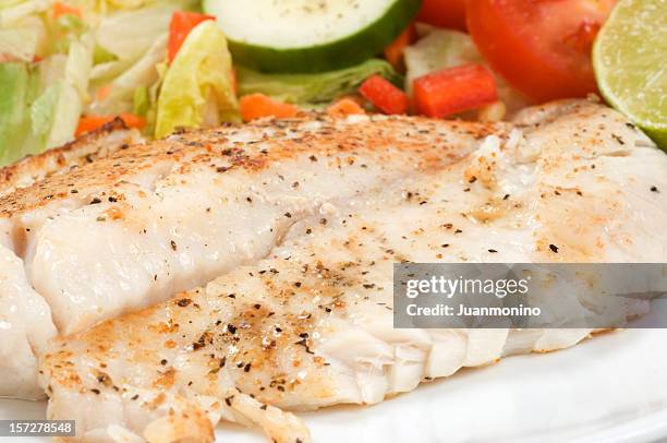 fillet of fish and salad - tilapia stock pictures, royalty-free photos & images