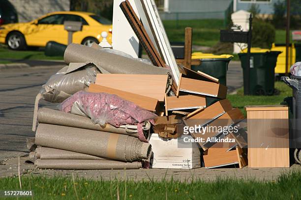 a pile of trash sitting on a curb - obsolete stock pictures, royalty-free photos & images