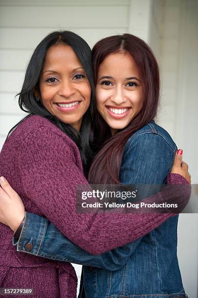 portrait of smiling mother and teenage daughter - adolescent daughter mother portrait stock-fotos und bilder