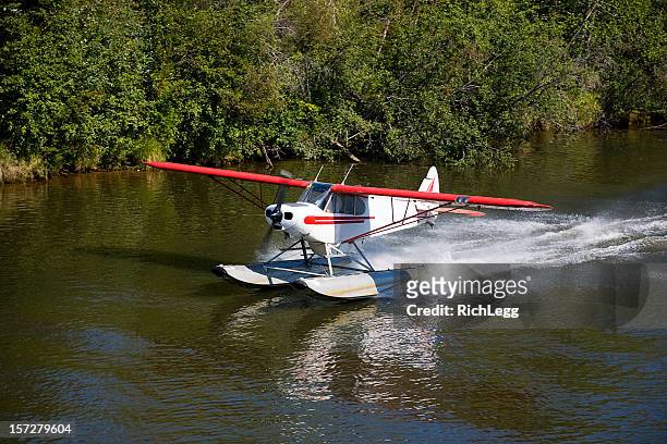 float plane taking off - seaplane stock pictures, royalty-free photos & images