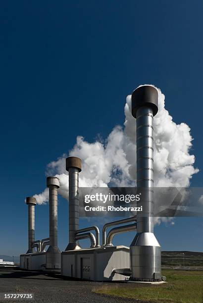 steam on blue sky - geothermische centrale stockfoto's en -beelden