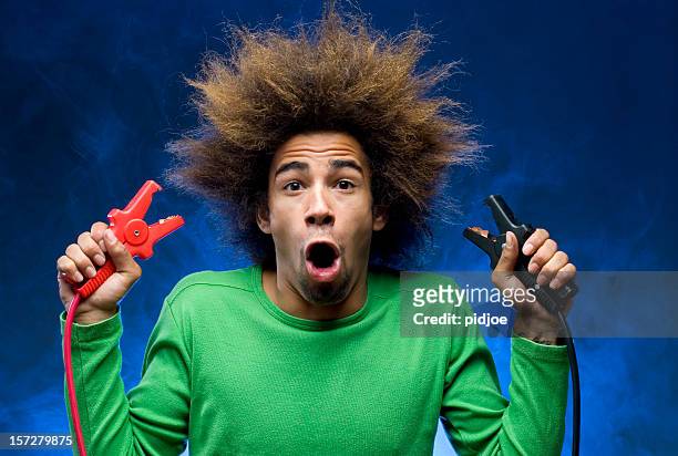 man creating short circuit causing smoke - jumper cable stock pictures, royalty-free photos & images