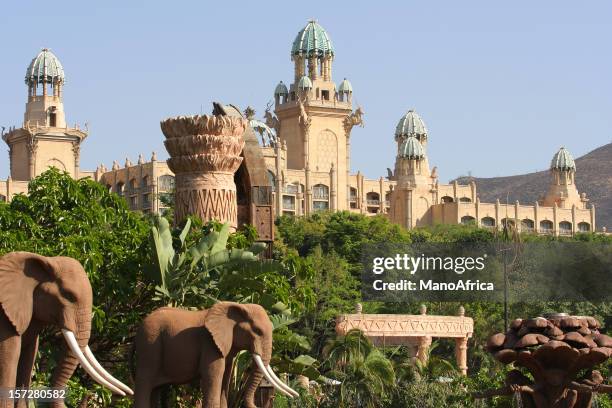 south african palace surrounded by trees and elephants - palace stock pictures, royalty-free photos & images