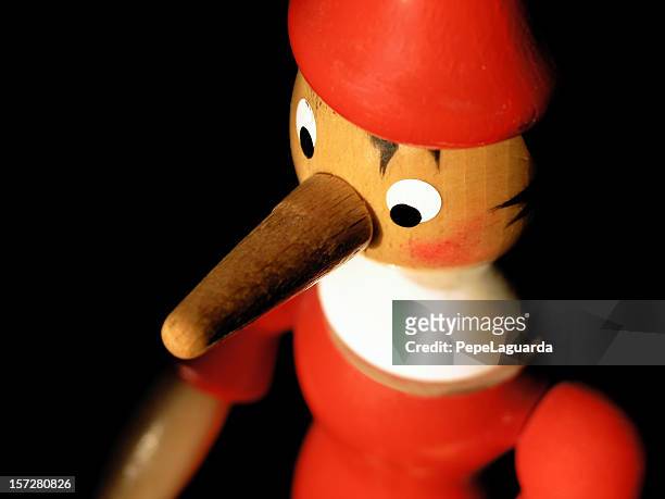 red liar! - pinocchio stock pictures, royalty-free photos & images